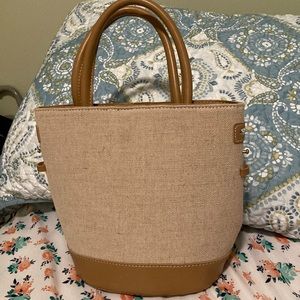 Gently used purse, minor tiny scratches on one side. In good condition.